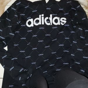 A black and grey adidas sweater